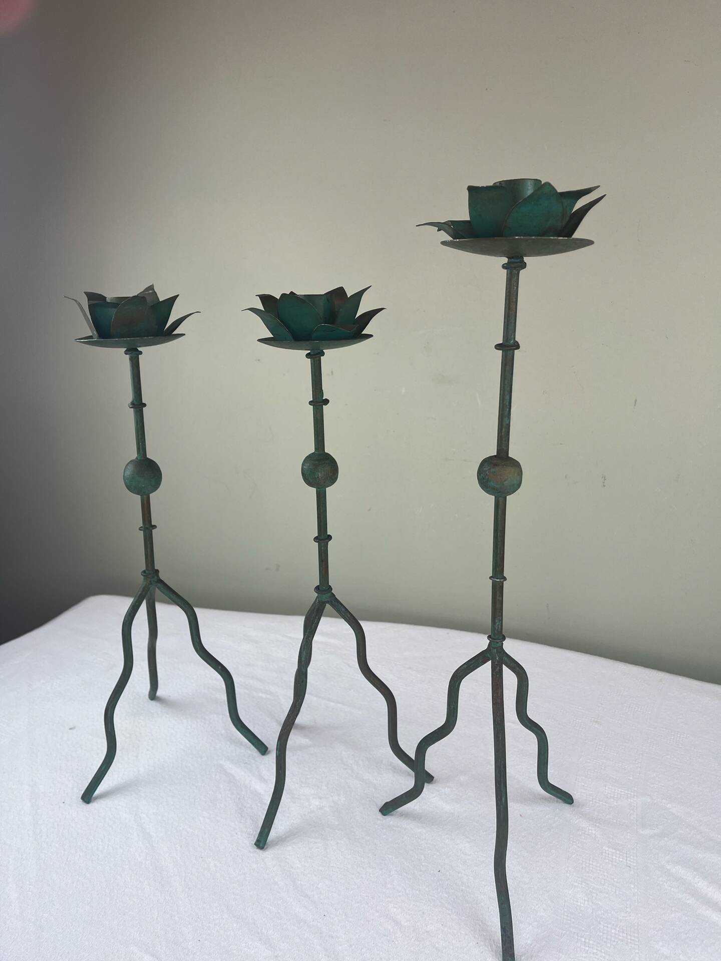 Sculptural candle holder trio