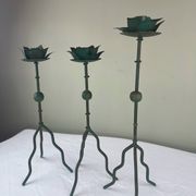 Sculptural candle holder trio