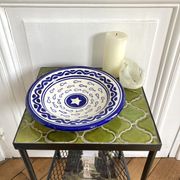 Decorative ceramic deep plate with fish decoration