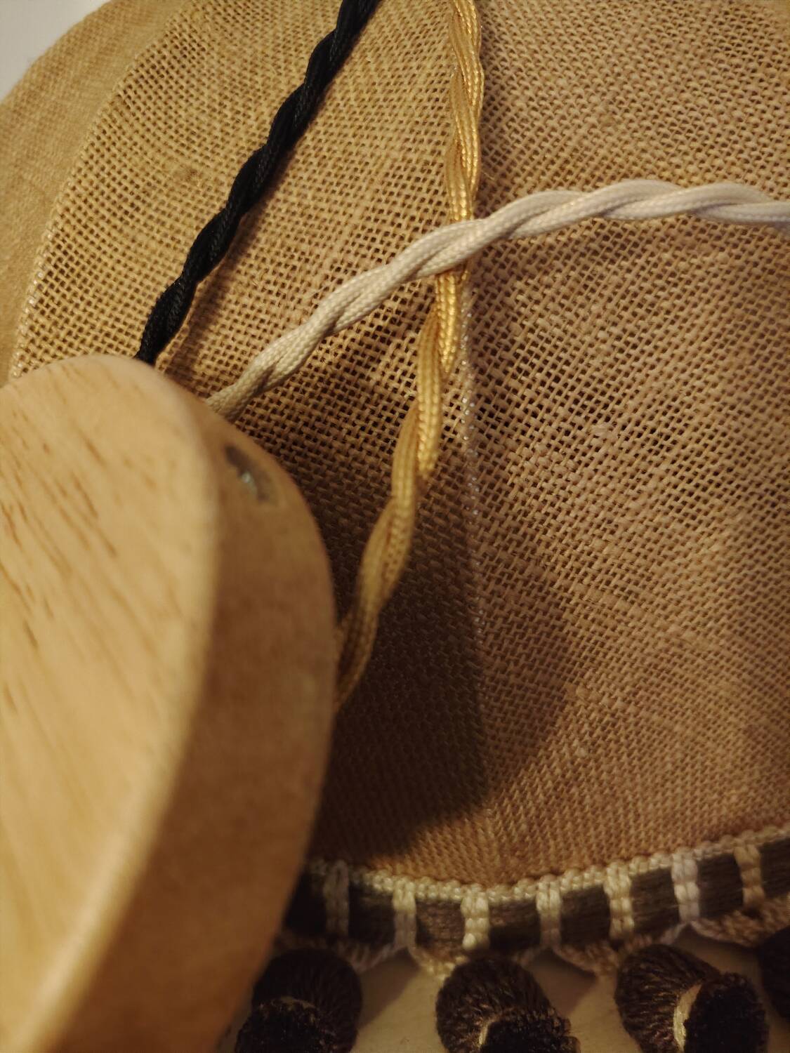 Large hanging pendant light with a burlap and pom-pom style