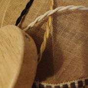 Large hanging pendant light with a burlap and pom-pom style