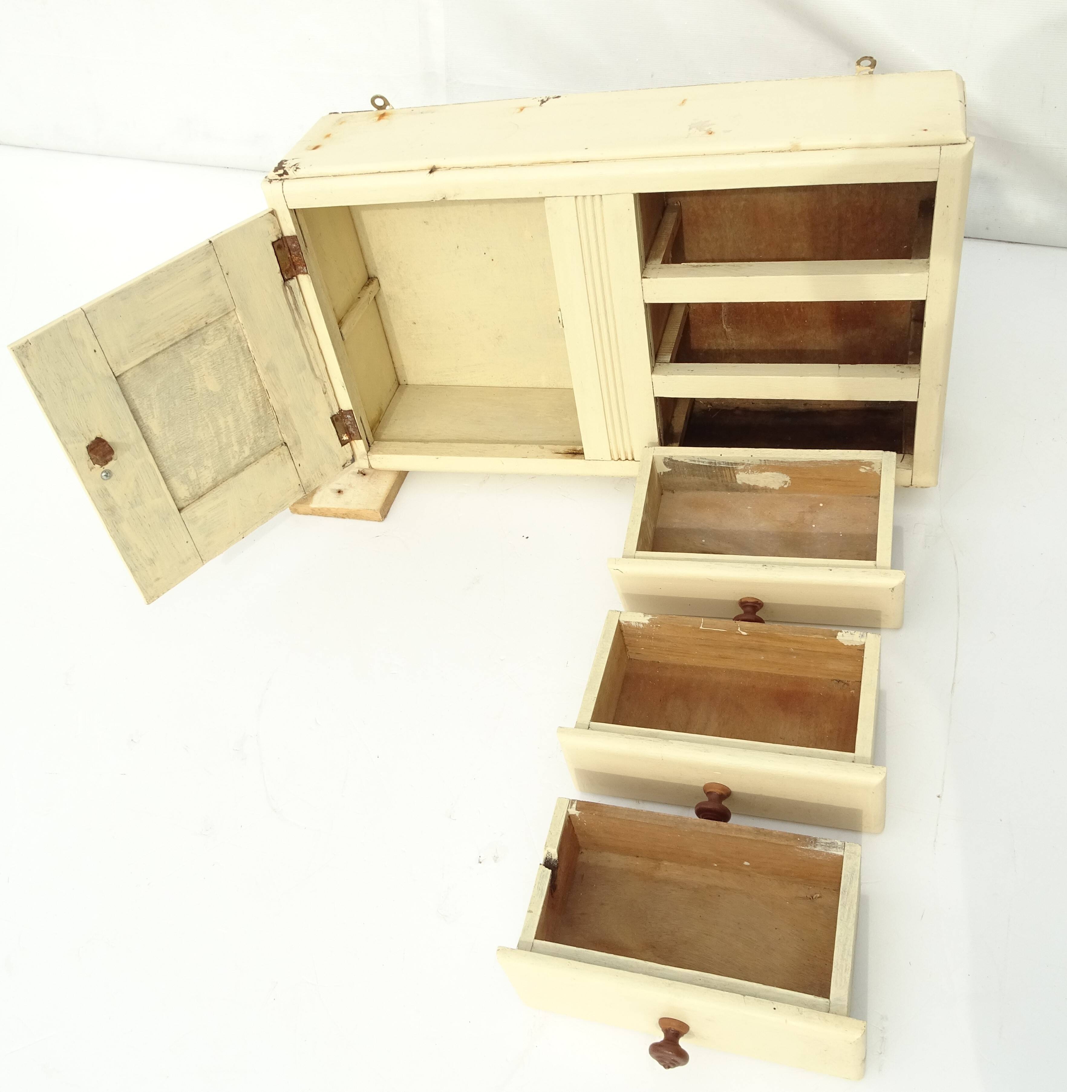 Small vintage wooden wall cupboard.
