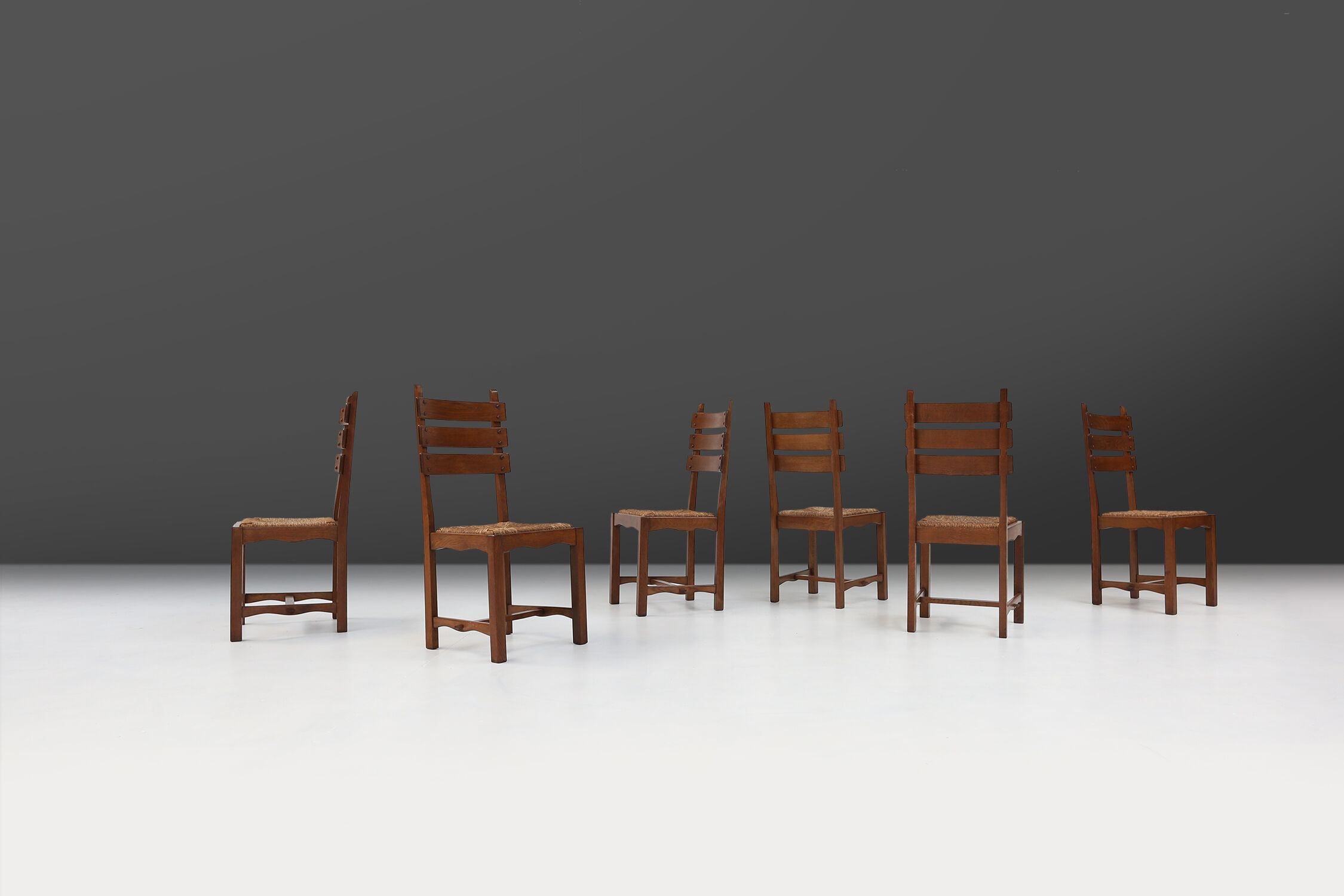 Set of six brutalist dining chairs in oak an wicker