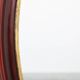 French Burgundy Lacquered Oval Mirror with Gilt Inner Edge, circa 1920