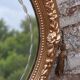 Miroir ovale vintage doré à décor floral et verre biseauté – 58 × 48 cm