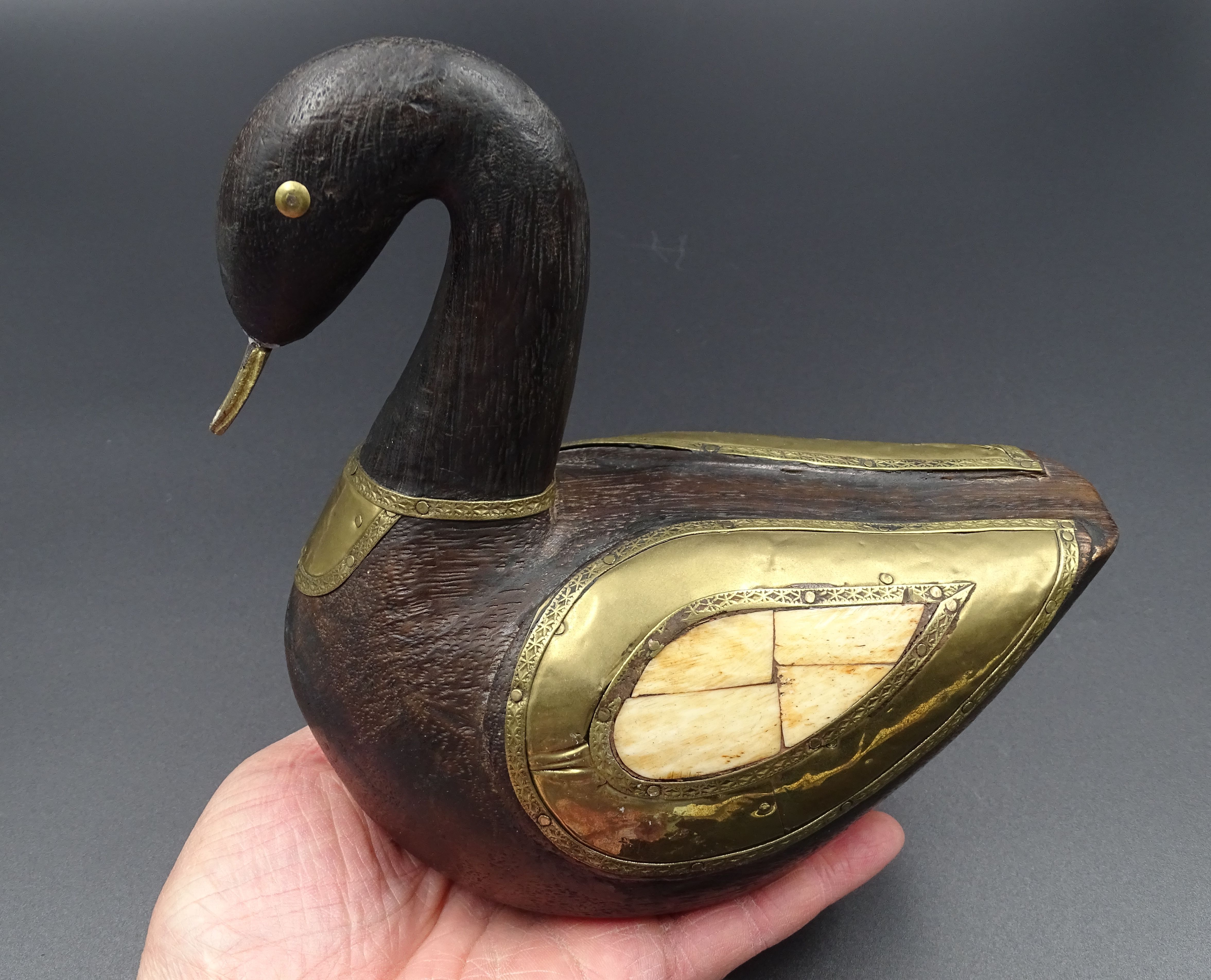 Wooden and brass swan