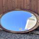Vintage oval mirror – Patinated gold floral decorative frame