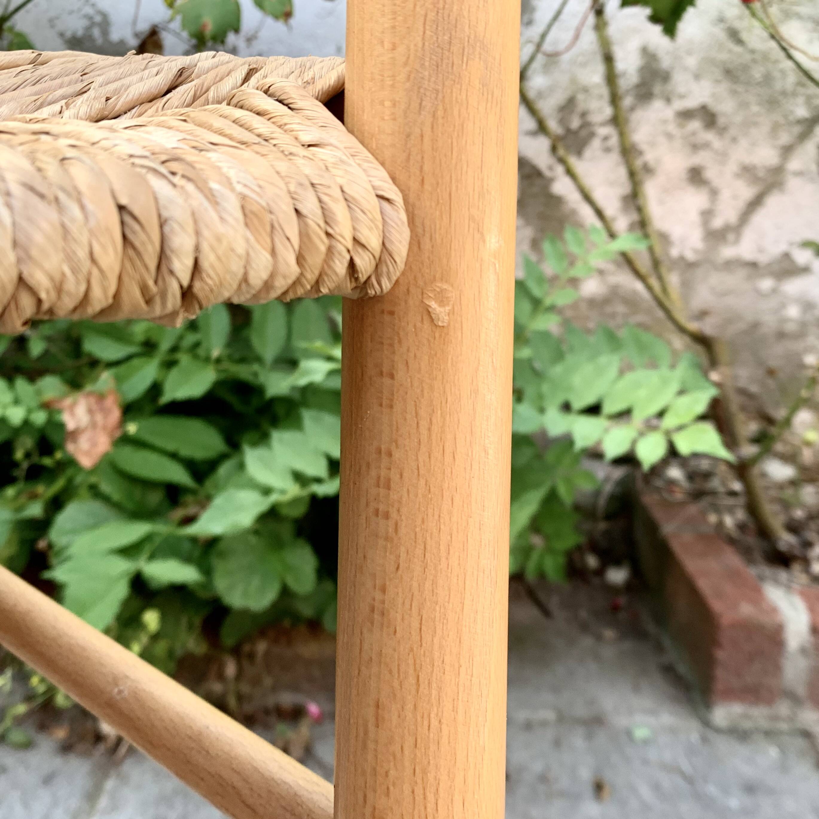 Old wooden and straw high chair for children