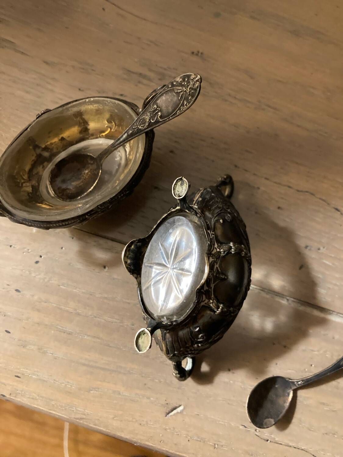 Salt and pepper shakers with silver spoons