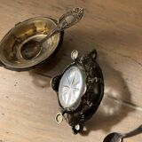 Salt and pepper shakers with silver spoons
