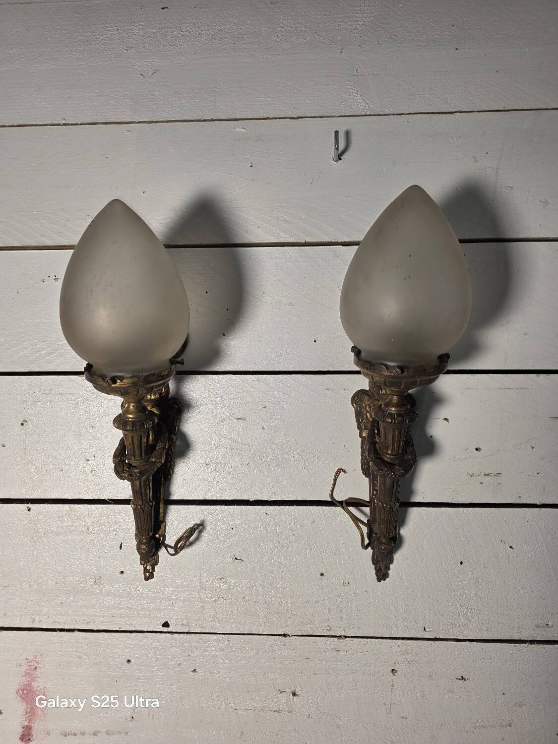 Pair of torch wall lights in Louis XVI style in 19th-century bronze.
