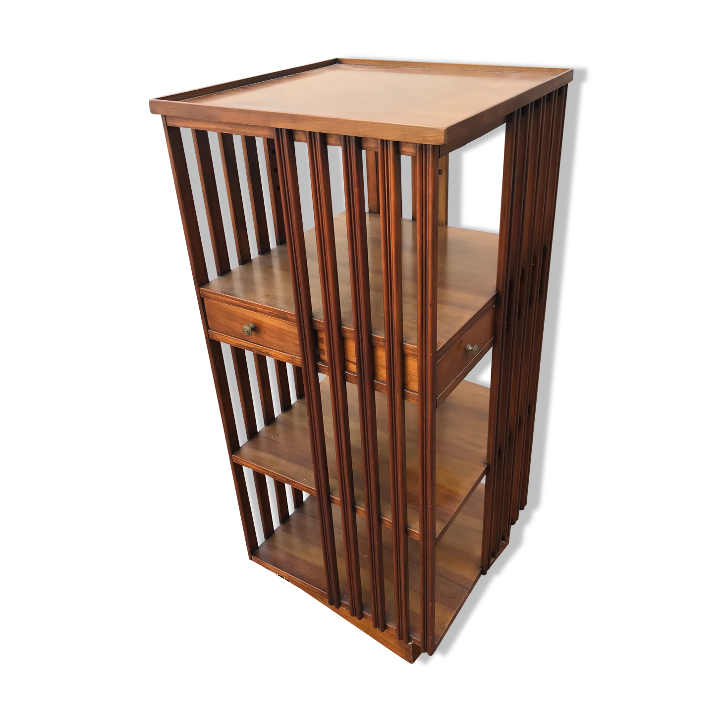 Revolving cherry bookcase