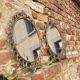 2 antique oval mirrors in heavy metal