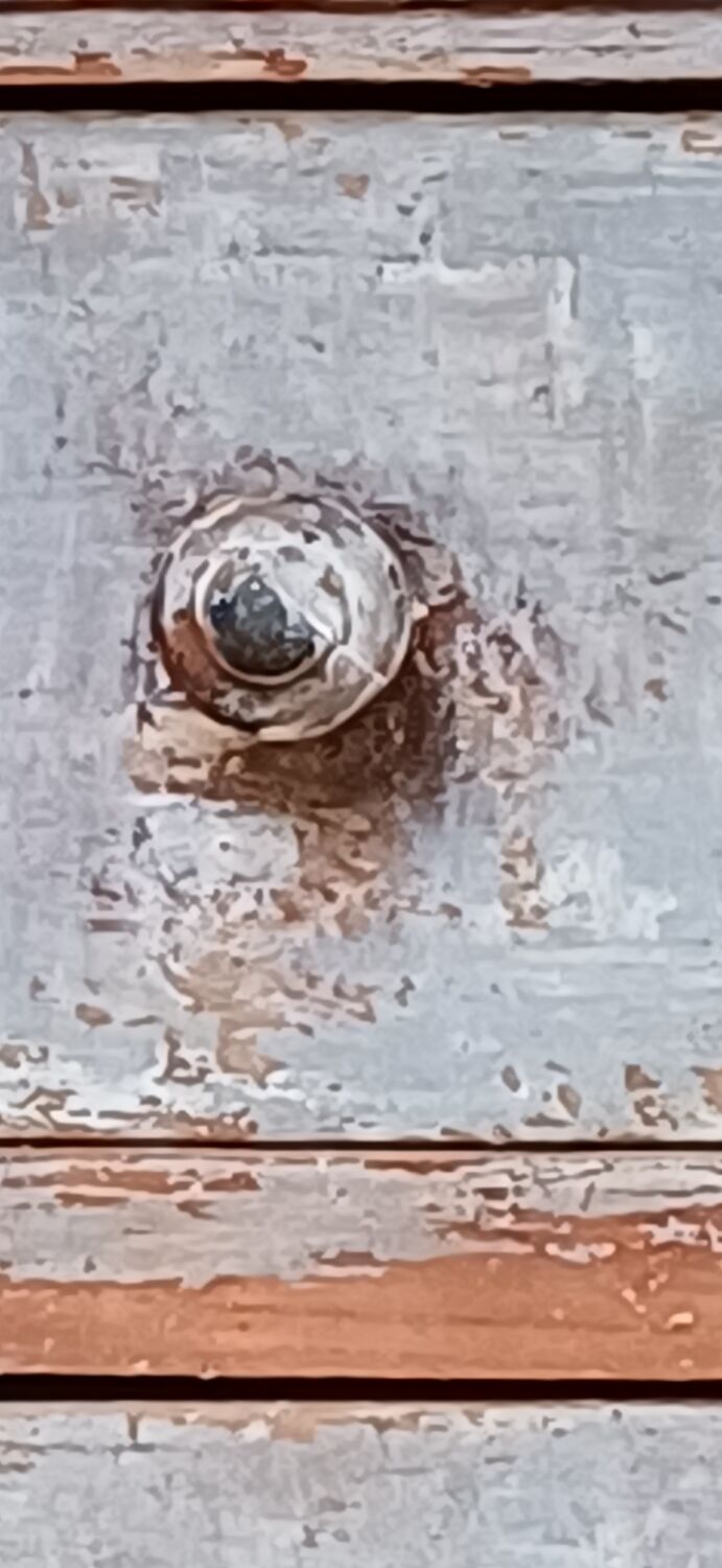 Antique piece of furniture with a grey patina.