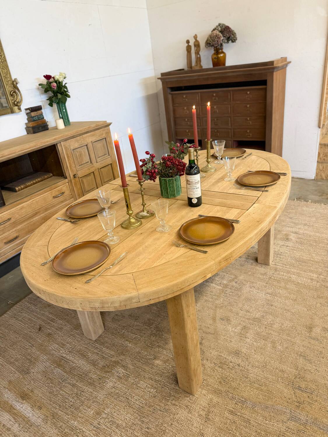 Oval farmhouse table in solid oak with extensions.