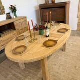 Oval farmhouse table in solid oak with extensions.