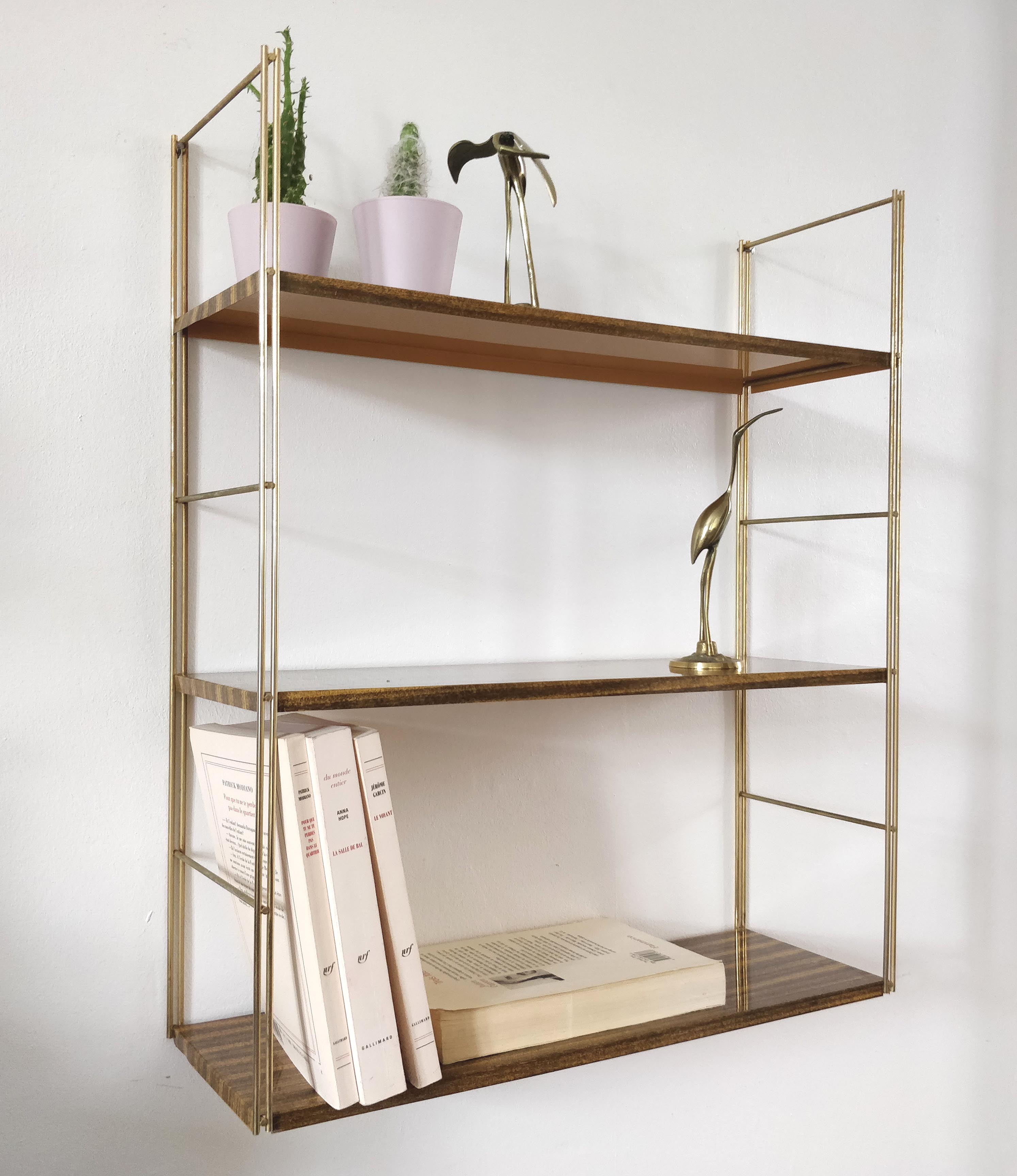 Brown metal string shelf and gilded studs 1960