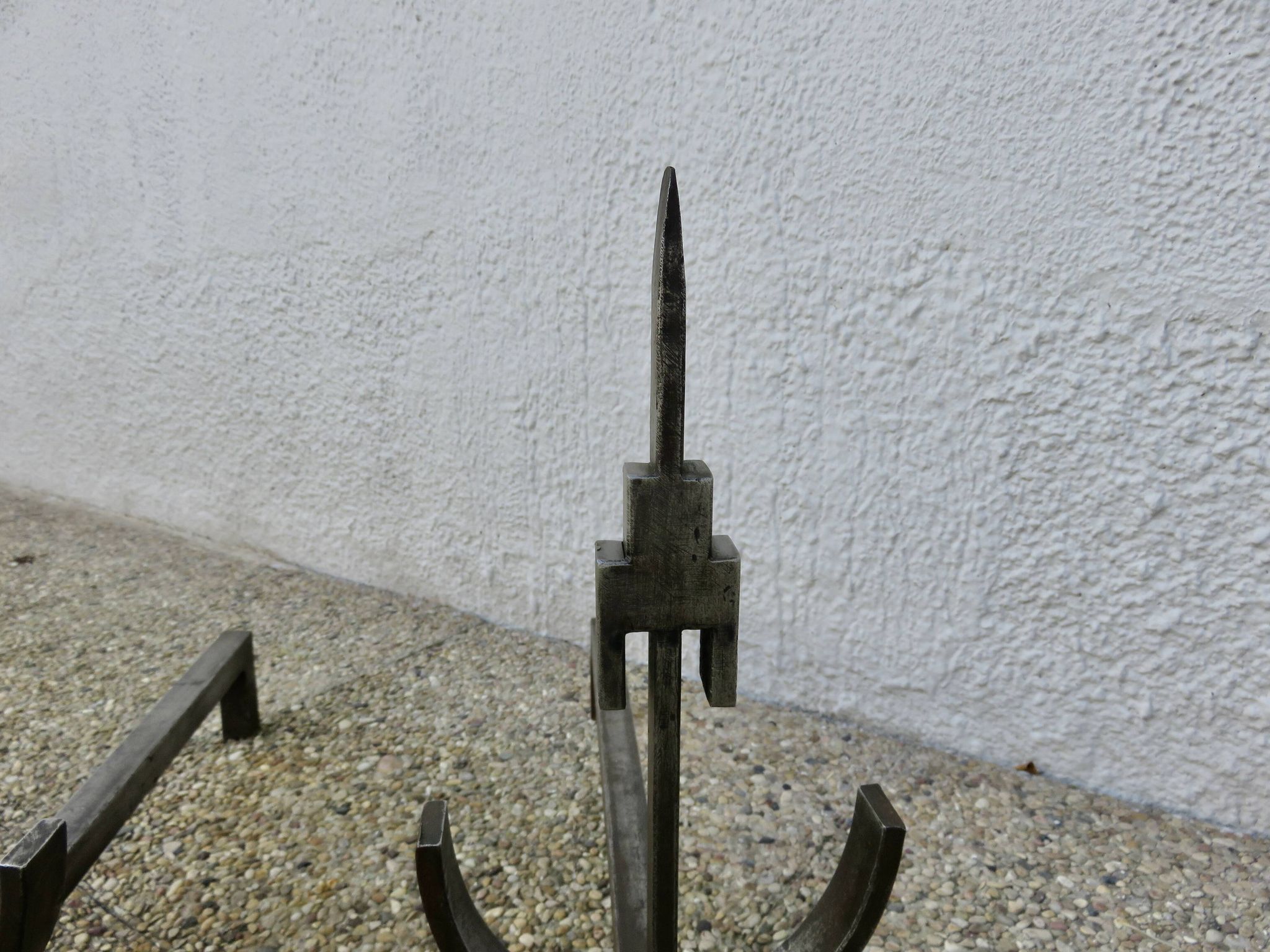 Pair of modernist andirons in forged and hammered steel, French work