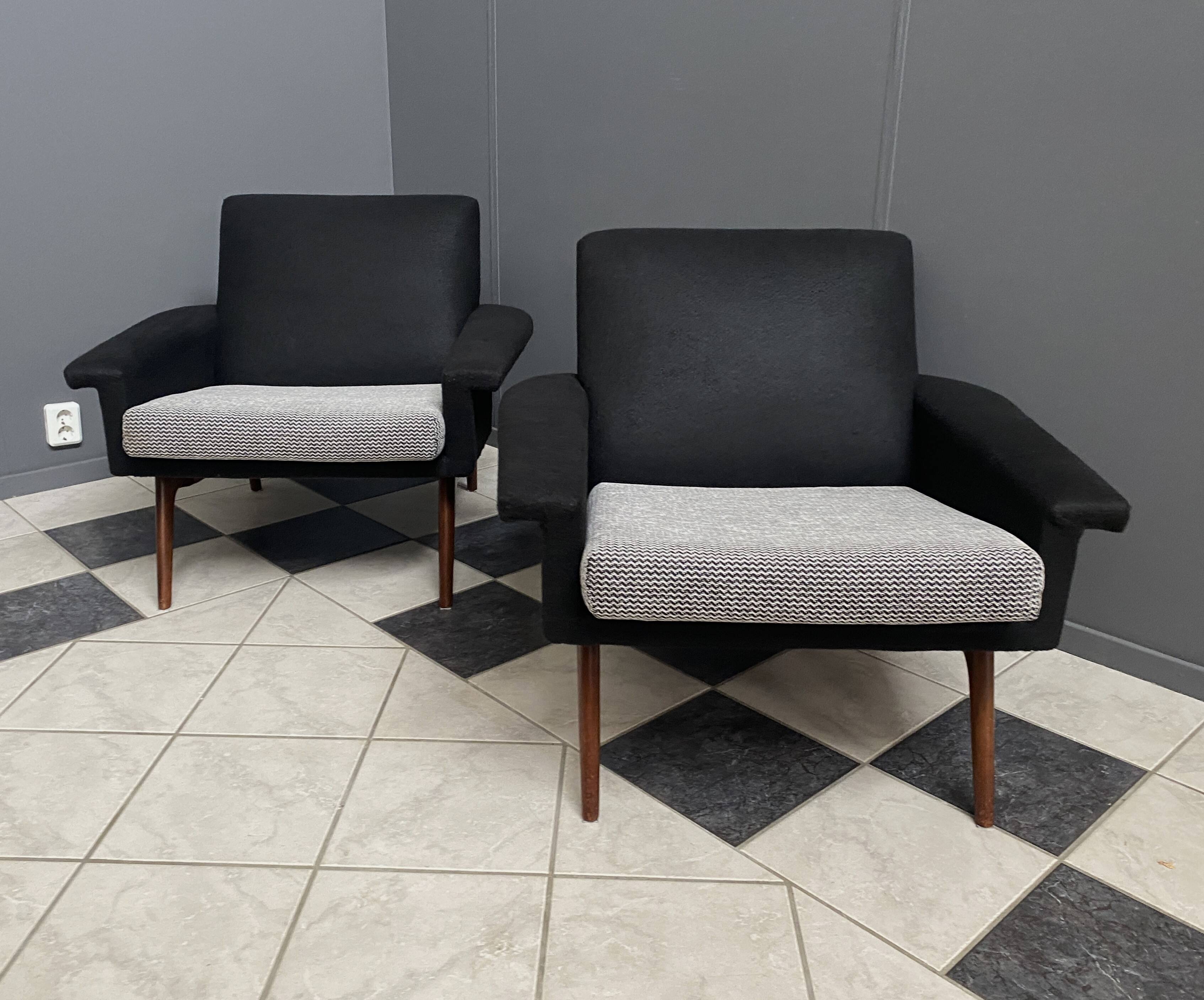 set of two black and white arm chairs 1960s