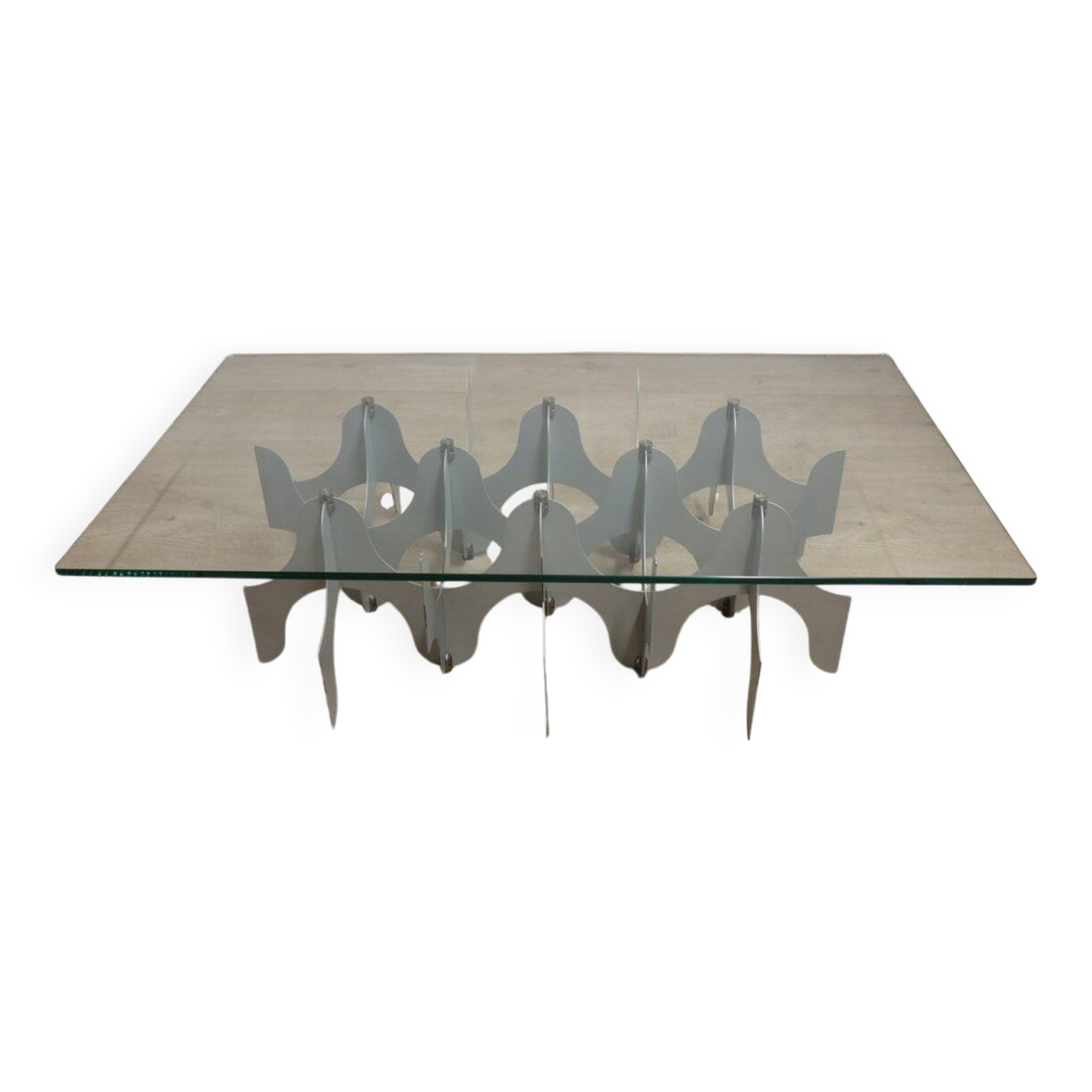 Minimalist sculptural coffee table in metal and glass