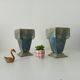 Pair of old art deco vases in enameled cast iron
