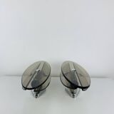 Pair of smoked glass and chrome wall lights from the 1970s.