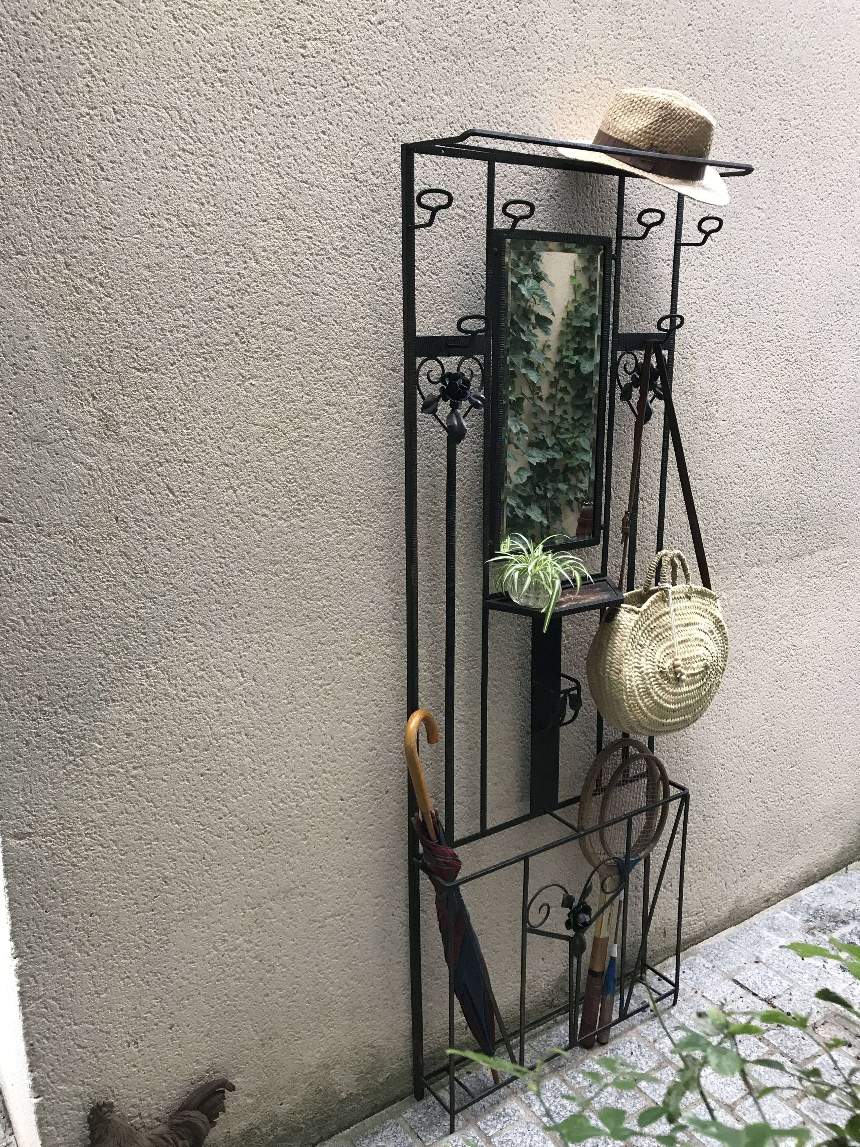 Wrought iron coat holder with 1930