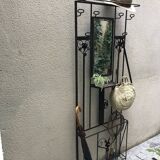 Wrought iron coat holder with 1930