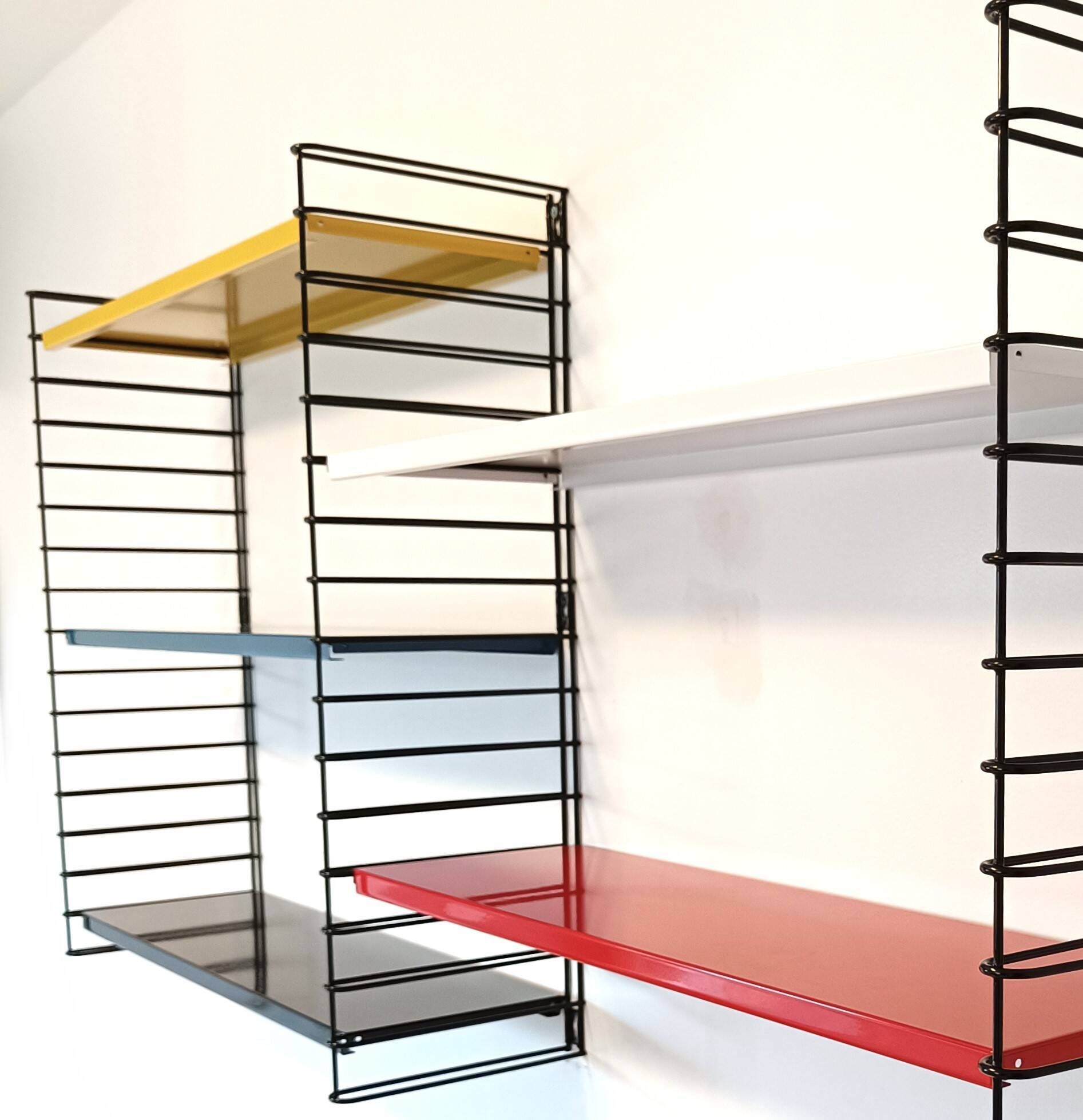 Tomado wall unit with metal shelves by A. Dekker