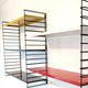 Tomado wall unit with metal shelves by A. Dekker