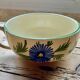 Large cup and saucer in the quimper earthenware style.