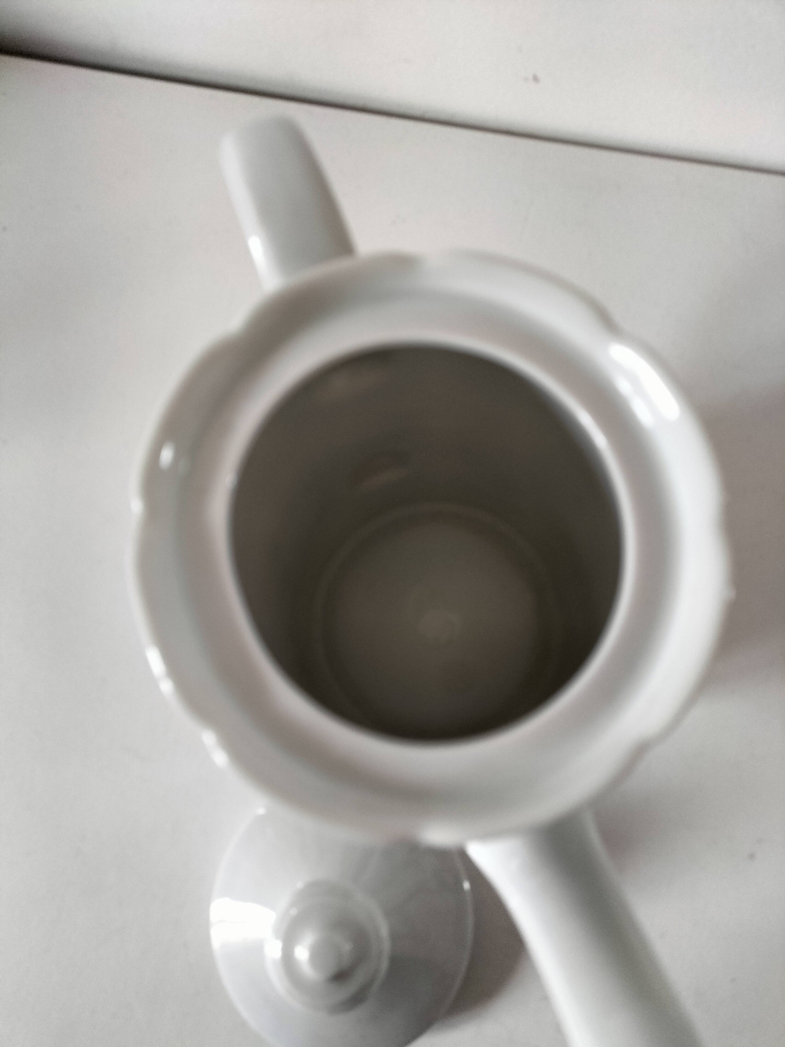 Vintage coffee pot Winterling Bavaria with orange floral decoration.