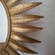 Large sun mirror in gilded metal. 1960