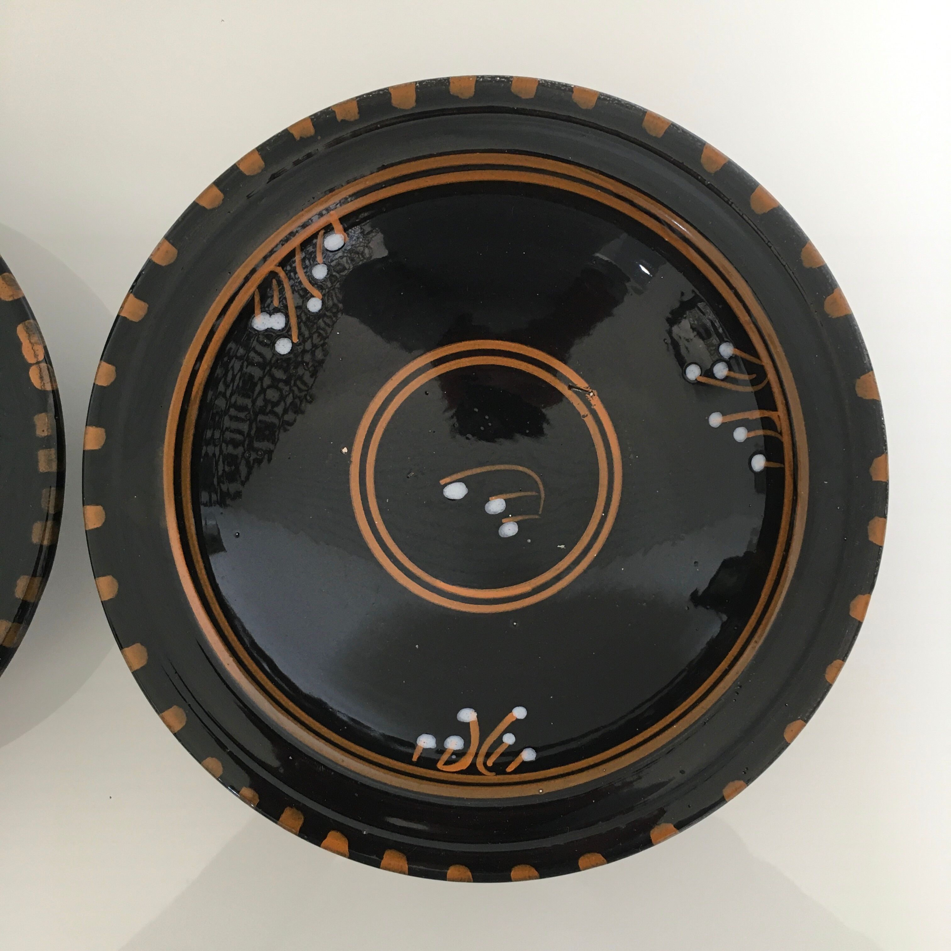 Set of 3 black decorative deep plates.