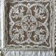 Former embroidered doily