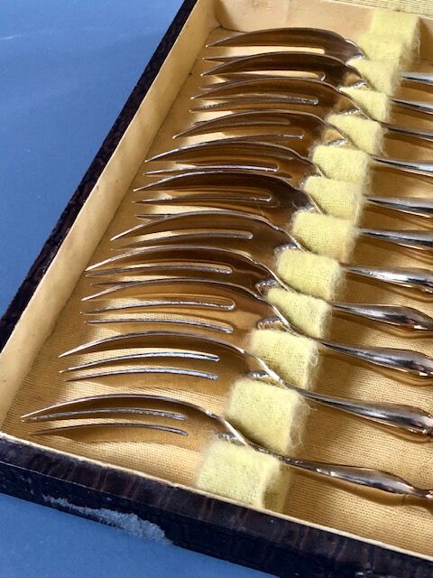Brass and yellow galathite cake forks