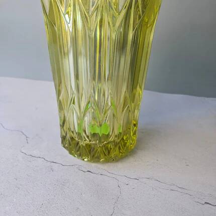 Large Czech vase in pressed glass, tinted yellow with geometric shapes.
