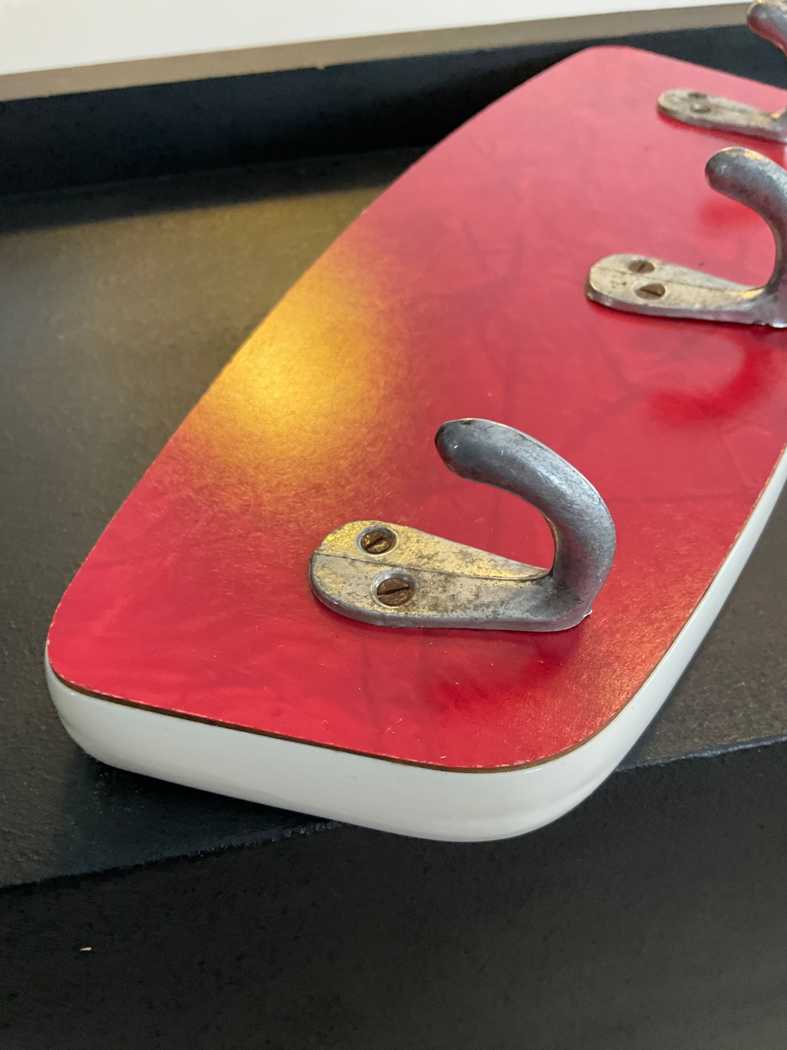 Asymmetrical coat rack of the 60s in formica