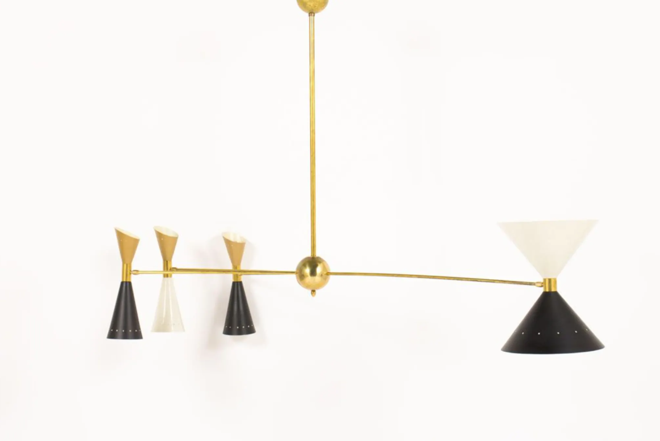 8-light brass chandelier and white-black and gold day blinds