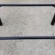 Black tubular coffee table with smoked glass by Yves Boutboul, 1980.