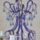 lustre bleu, fait de perles.