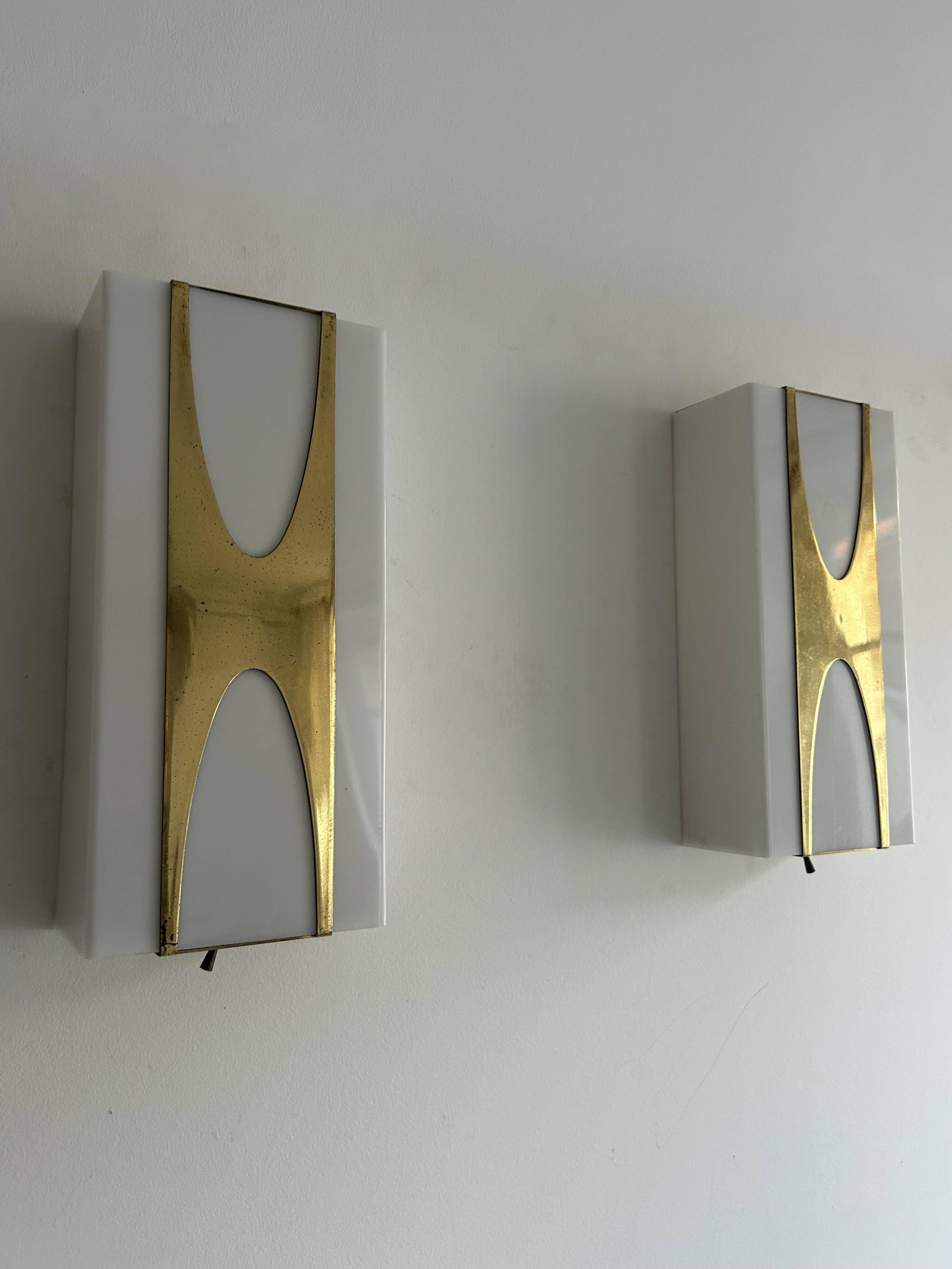 Pair of Loewy wall lights for Hilton, brass and Perspex, France 1965