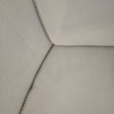 Two-seater sofa and a grey leather armchair Italia.