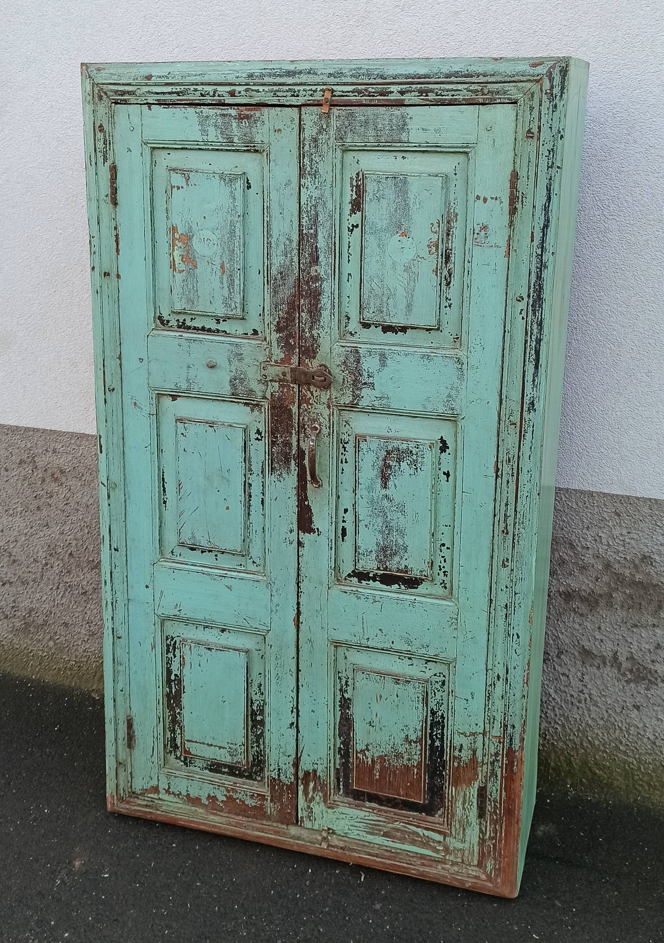 Old wooden cabinet with beautiful green patina