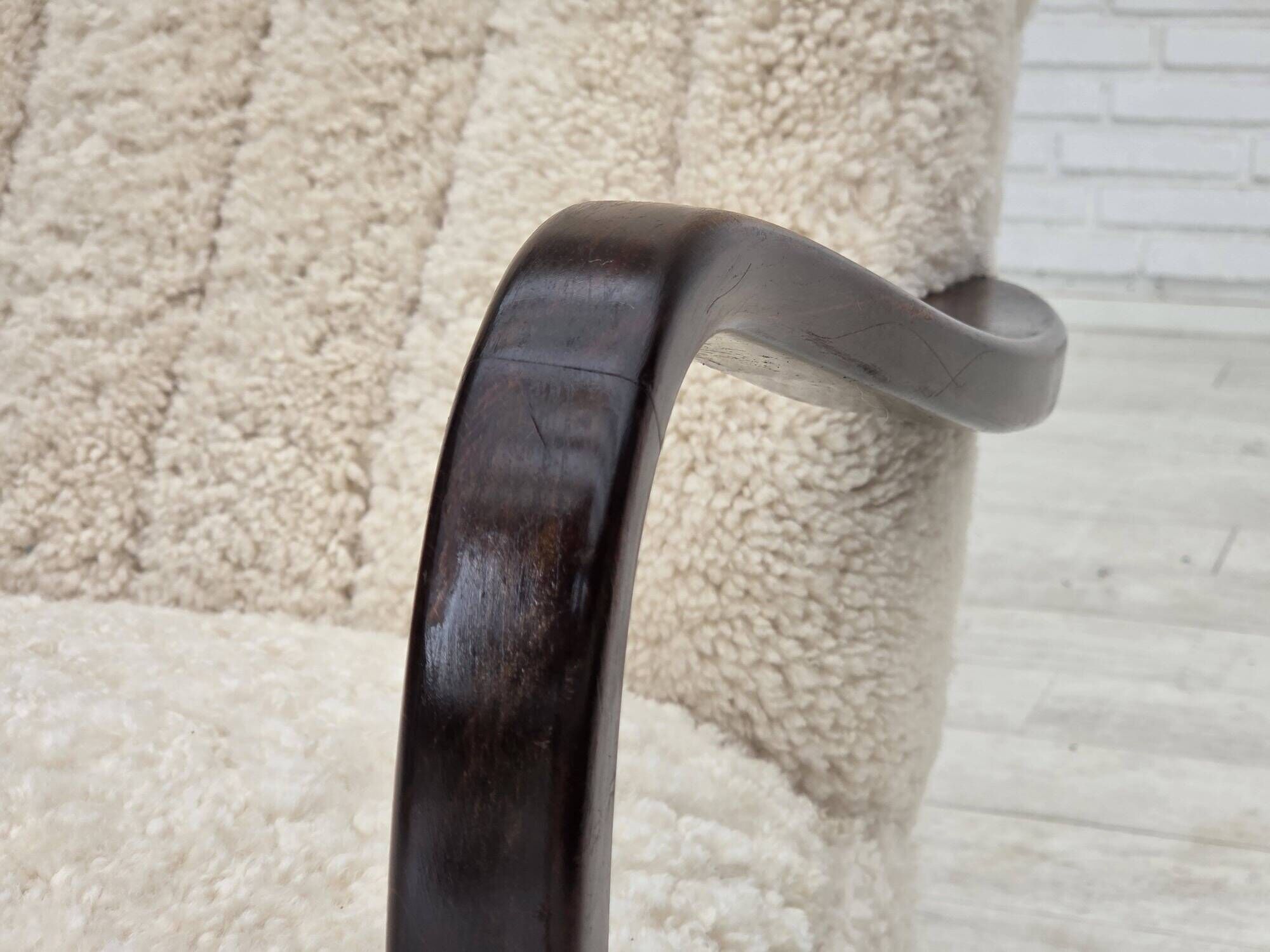 1960s, Danish high-back armchair, genuine sheepskin, reupholstered.