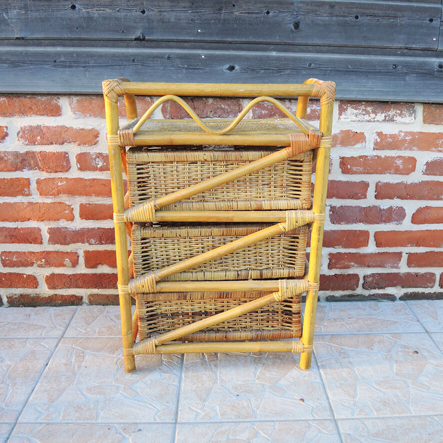 Old chest of drawers with 3 bamboo and wicker drawers.