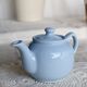 Small vintage sky-blue earthenware teapot