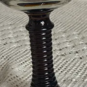 Footed glasses of the Roemer type, amber colour
