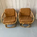 Pair of leather and bamboo armchairs