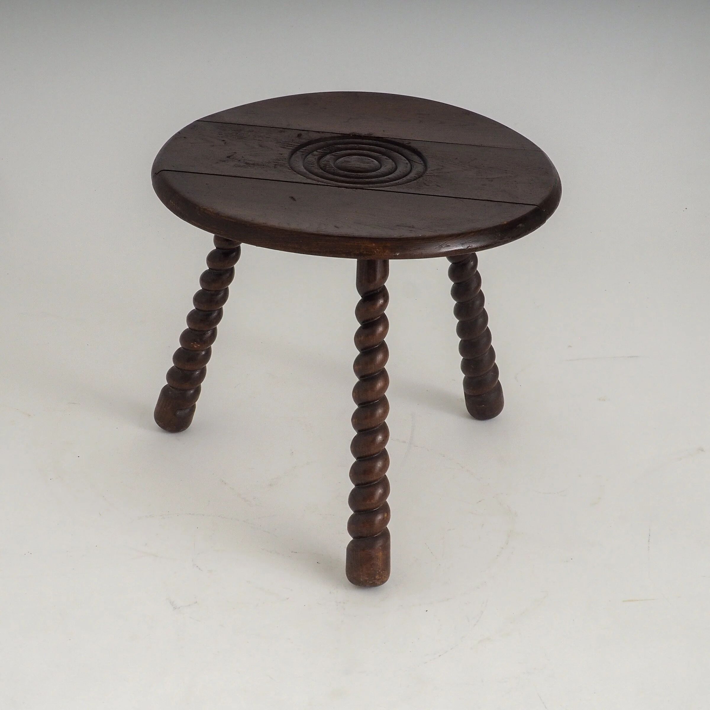 French oak tripod side table attributed to Charles Dudouyt